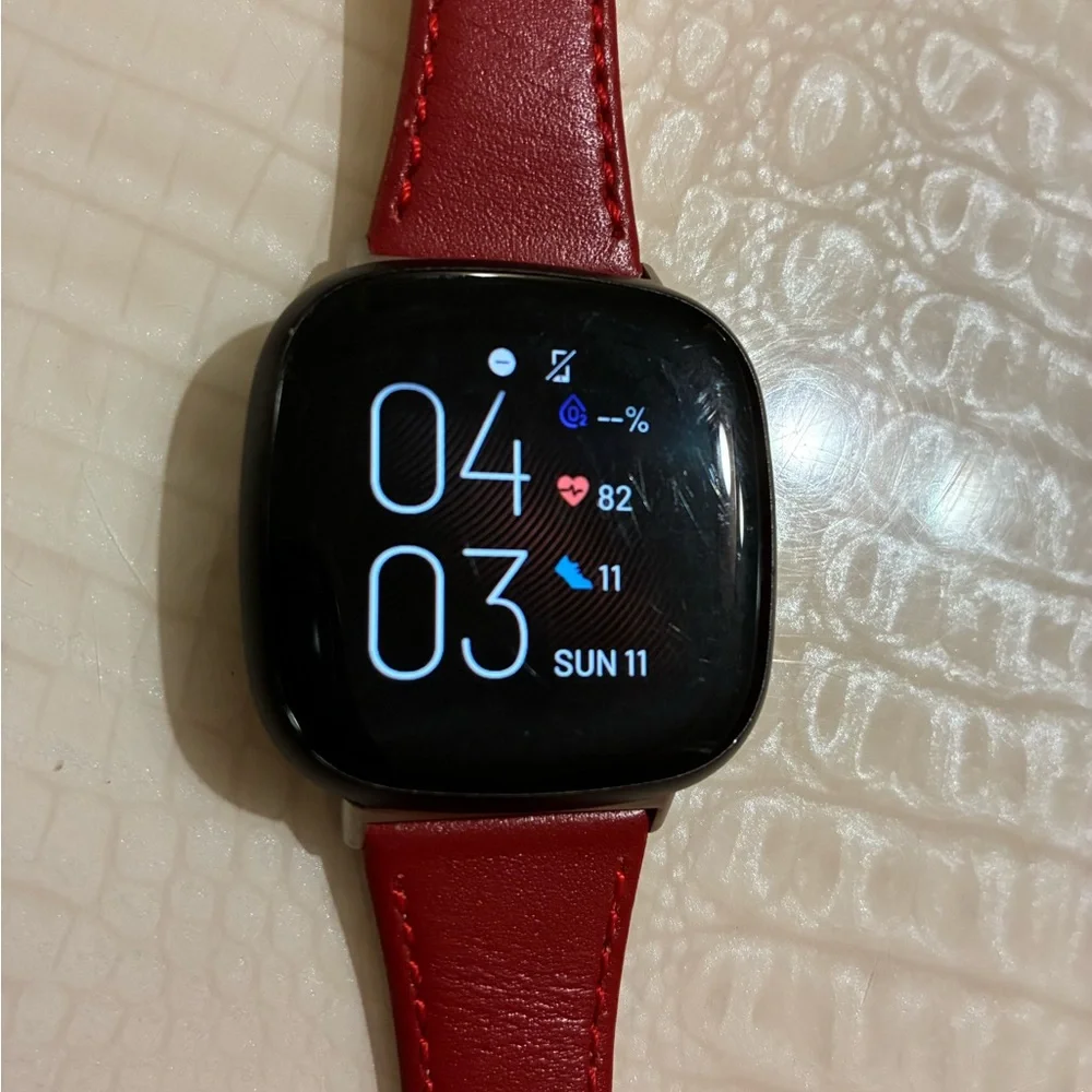 Fitbit Smartwatch with Red Strap